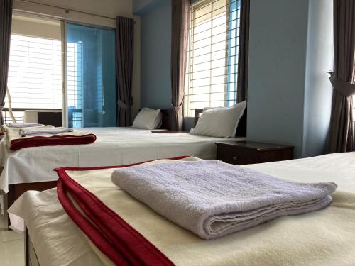 Кровать или кровати в номере YMCA Training Center and Guest House