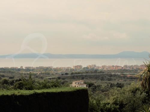 a view of a city from a field with a house at Alquiler de espaciosa casa en privilegiada zona residencial cercana a Roses y Empuriabrava - ES-366-9 in Palau-Saverdera