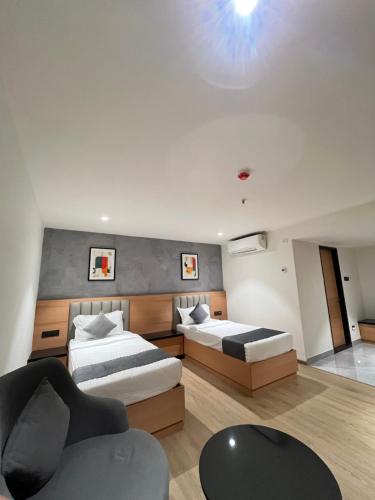 Postel nebo postele na pokoji v ubytování Hotel Tulips Grand
