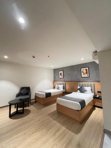Postel nebo postele na pokoji v ubytování Hotel Tulips Grand