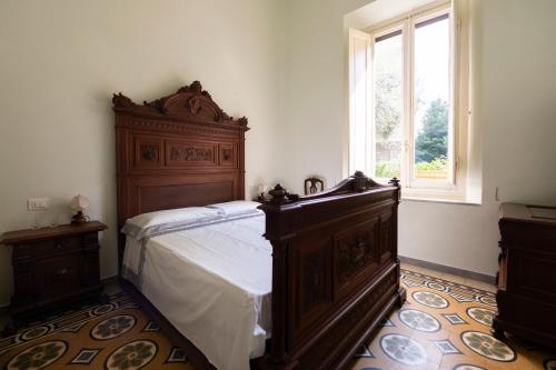 Postel nebo postele na pokoji v ubytování Villa dell'Artista - Camere con bagno privato in Villa storica