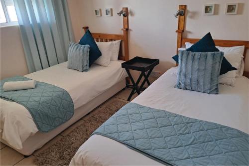 Port Indigo Guest Houseにあるベッド