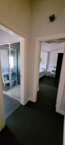 a room with a glass door leading to a bedroom at Avalon in Setenil in Setenil