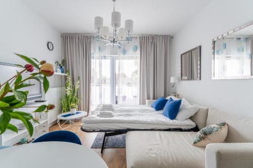 Postel nebo postele na pokoji v ubytování Apartament Sunset Resort 25 SurfingBird Grzybowo