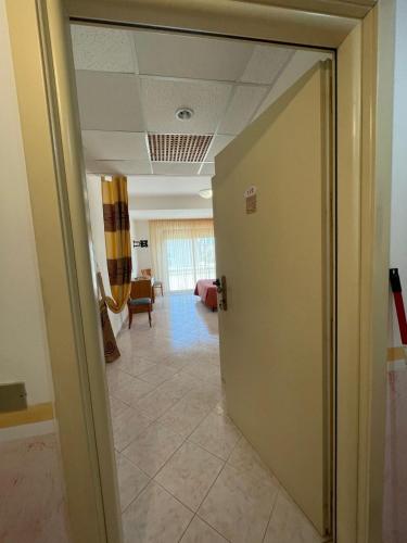an office hallway with a door leading into a room at Hotel Lungomare Brancaleone in Brancaleone Marina