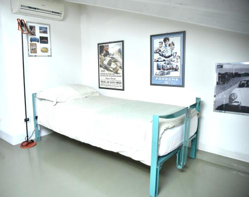 Una cama o camas en una habitación de Cesare Magli & Figli Residenza D'Epoca Luxury Rooms