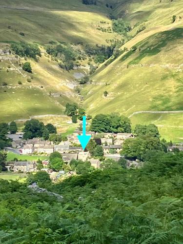 an aerial view of a village in the hills at The Dale - Luxurious annexe with stunning view in Buckden