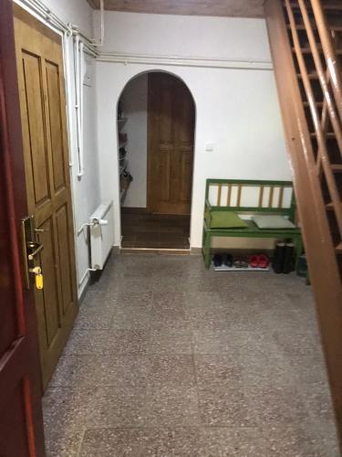 a hallway of a room with a bed and a door at The House Next to the Forest - LAKMAT in Nové Hamry