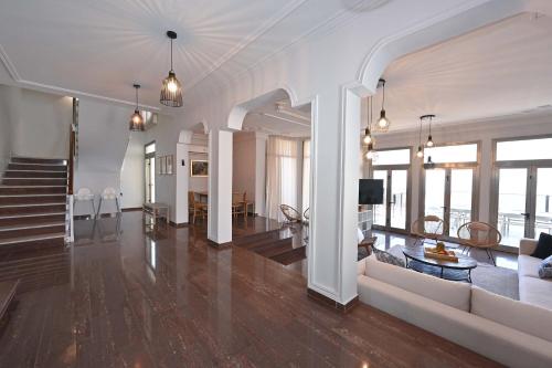a large living room with a couch and a table at Villa Blue Horizon in Tiberias