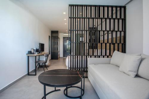 a living room with a couch and a table at Aiora Resort in Pefki Rhodes
