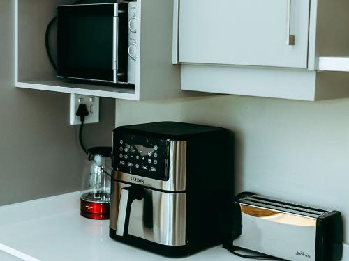 a coffee maker on a counter in a kitchen at Galloway Guest House in Robertson