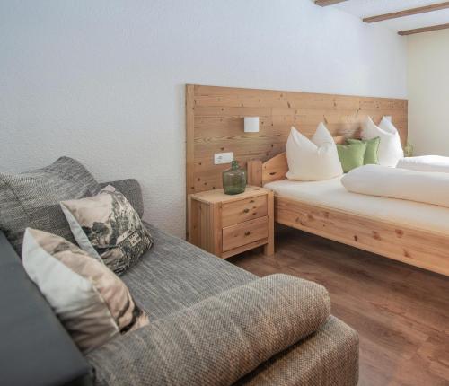 Un ou plusieurs lits dans un hébergement de l'établissement Appartements Rudigier