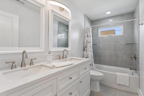 a white bathroom with a sink and a toilet at 225 E Youngs Ave, Unit A in Wildwood