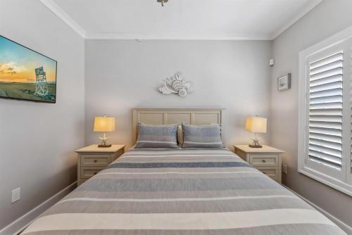 a bedroom with a large bed with two night stands at Residence 304S At The Sandcastle Condominiums in Wildwood Crest