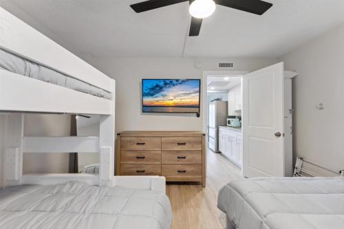 a bedroom with two beds and a ceiling fan at 301 Ocean Ave, Unit 204 - The Harbor Light in North Wildwood