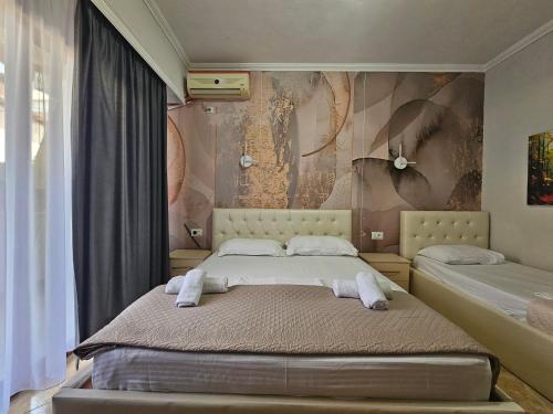 Postel nebo postele na pokoji v ubytování Hotel Pini