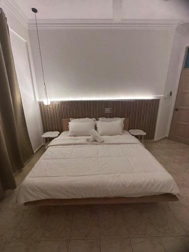 Ένα ή περισσότερα κρεβάτια σε δωμάτιο στο Cozy Muji Concept Home