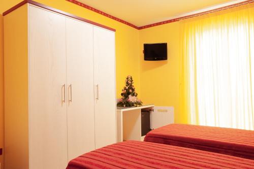 Postel nebo postele na pokoji v ubytování Stanza per 2 ospiti nel centro, a due passi dal mare - Il Mozzo!