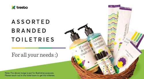 a basket with someentedentedented toothbrushes and cosmetics at Treebo Premium The Mustard Inn Lawrence Road in Amritsar