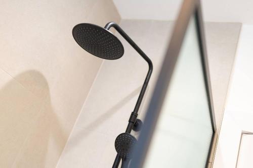 a microphone hanging on a wall at Taigh Tatha in Broughty Ferry