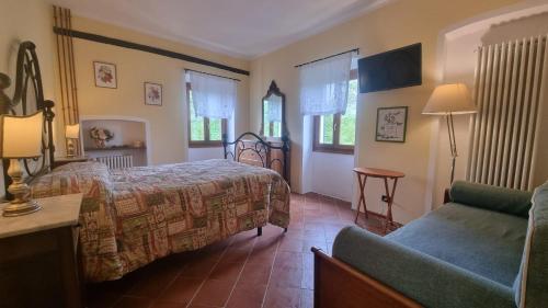 Ένα ή περισσότερα κρεβάτια σε δωμάτιο στο Agriturismo Cascina Tollu