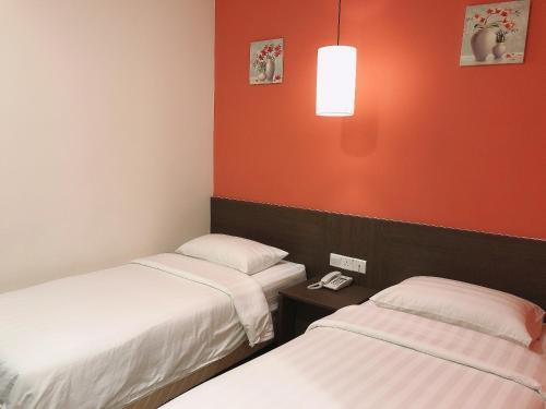 Кровать или кровати в номере GPI HOTEL Bentong