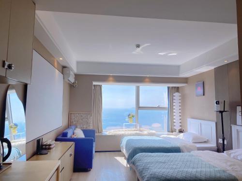 Katil atau katil-katil dalam bilik di Azure Haven Seaview Suites Shilaoren Coast