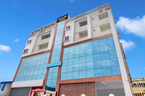 a building with a sign on top of it at Super Hotel O Murali Nagar Near NAD Junction in Visakhapatnam