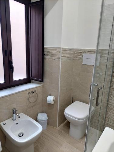 a bathroom with a toilet and a sink and a shower at Sweet dreams AF in Palermo