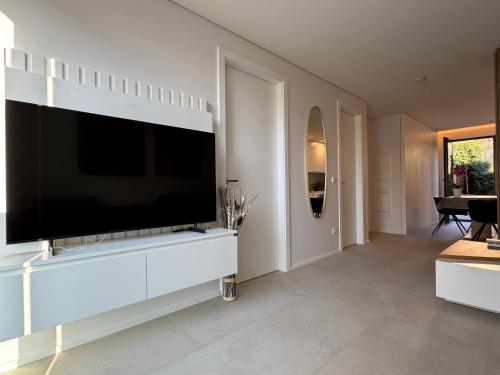 a living room with a large flat screen tv at Marcel Cahen 5 Luxurious Home for Families Groups and Events in Luxembourg