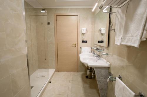 a bathroom with a sink and a shower at Grand Hotel Tiberio in Rome