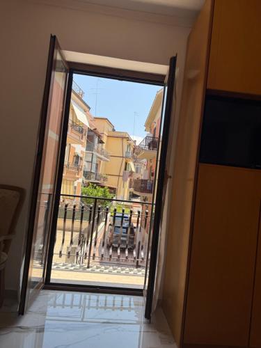 an open door with a view of a balcony at Kapo Azzurro in Monterotondo