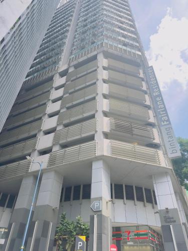 a tall building with a sign on the side of it at Bukit Bintang KLCC Fairlane suite by Rose in Kuala Lumpur