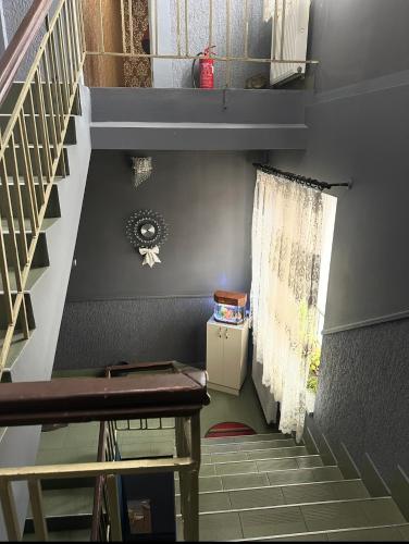 a stairway with a stair case in a house at Welcome 24 Mukachevo in Mukacheve