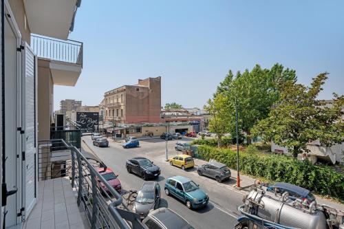a view of a city street with cars parked on the road at Grimaldi Rooms in Pagani