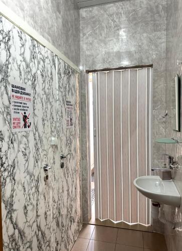 a bathroom with a shower and a sink at Welcome 24 Mukachevo in Mukacheve
