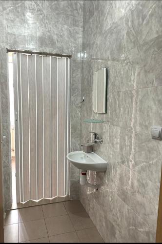 a bathroom with a sink and a shower at Welcome 24 Mukachevo in Mukacheve