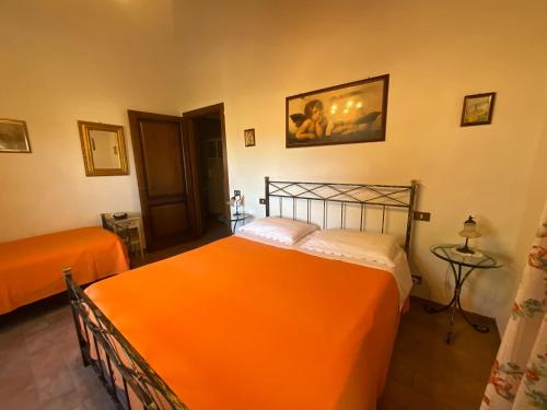 Ένα ή περισσότερα κρεβάτια σε δωμάτιο στο Agriturismo Sant'Angelo
