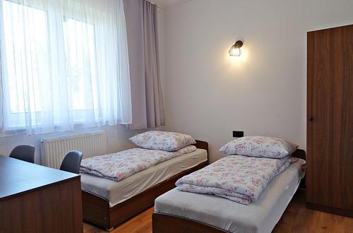 Postel nebo postele na pokoji v ubytování DW Jarosze