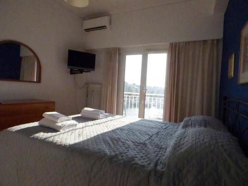 Ένα ή περισσότερα κρεβάτια σε δωμάτιο στο Serenity View Apartment - Marina Zeas