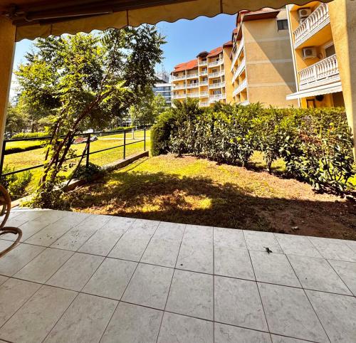 a walkway leading to a yard with a building at Bliss Apartment Balatonfured in Balatonfüred