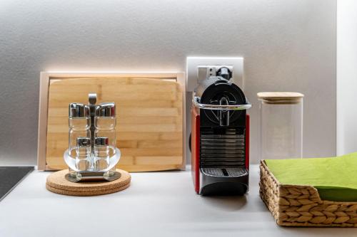 a black and red blender sitting on a counter at Borgo delle Botteghe Luxury Suites in Parma