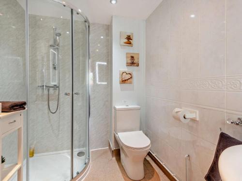 a bathroom with a toilet and a glass shower at 2 Bed in Kirby Stephen SZ265 in Ravenstonedale