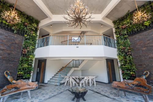 a building with a spiral staircase and a balcony at The Foresta Resort ,Mulshi in Paud