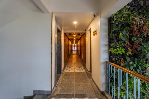 a hallway with plants on the wall at The Foresta Resort ,Mulshi in Paud