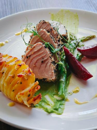 a plate of food with meat and vegetables on it at Oaga Art Resort Maldives - Greatest All Inclusive Plan with Free Speedboat Round-trip in North Male Atoll