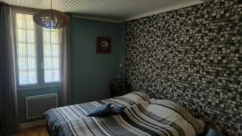 Postel nebo postele na pokoji v ubytování Le Mas Bellanger