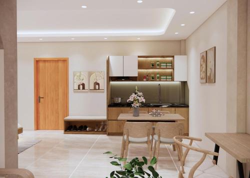 a kitchen with a table and chairs in a room at Boutique En Hotel Sapa in Sa Pa