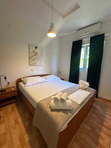 Postel nebo postele na pokoji v ubytování Apartments Alać