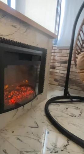 a fireplace with some food cooking in it at Samsun Osmanlı Otel in Samsun